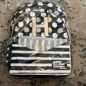Justice initial H backpack with detachable wristlet.